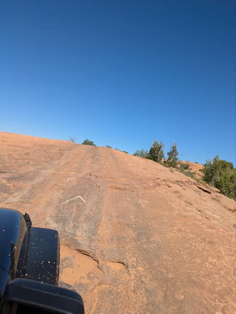The painted line up the slickrock
